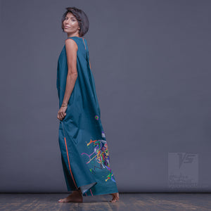 Unusual wrap around avant garde emerald dress. Suitable for expecting mothers
