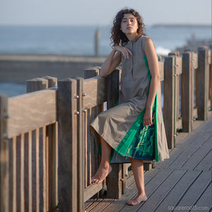 Avant garde festival grey-green dress with short sleeves.