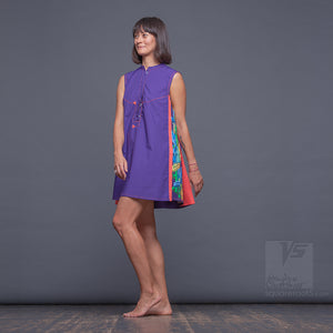 Bright, geometrical aesthetic dress with short sleeves. Violet and orange.