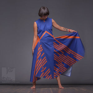 Long avant-garde dress with a geometric eccentric design. Experimental festival design with geometric pattern.