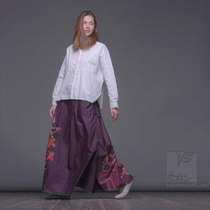 Uncommon long semi pleated skirt.